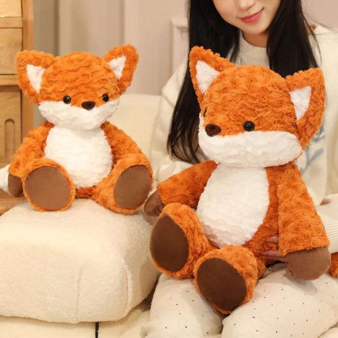  Two Running Fox Plush Toys in different sizes sitting together, perfect for companionship in any space.