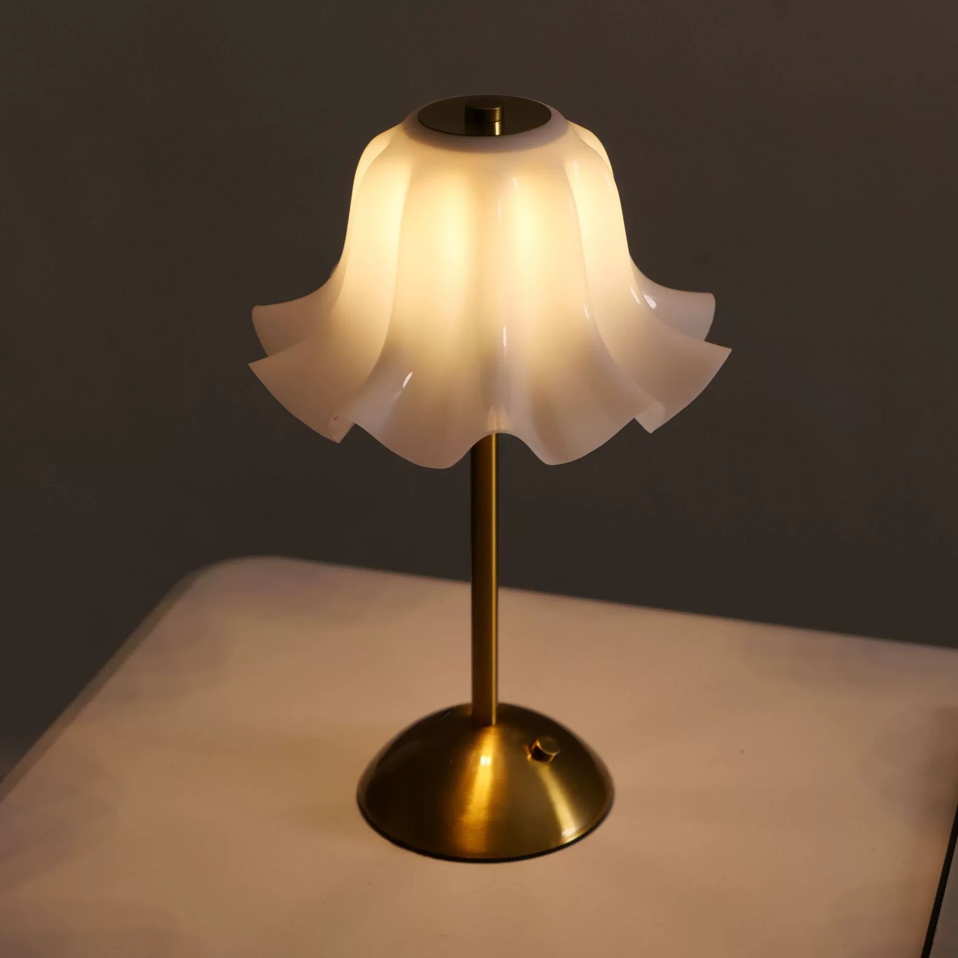 Side profile of the Floral Grace Desk Lamp, emphasizing its gentle curves and the harmonious balance between the shade, stem, and base.