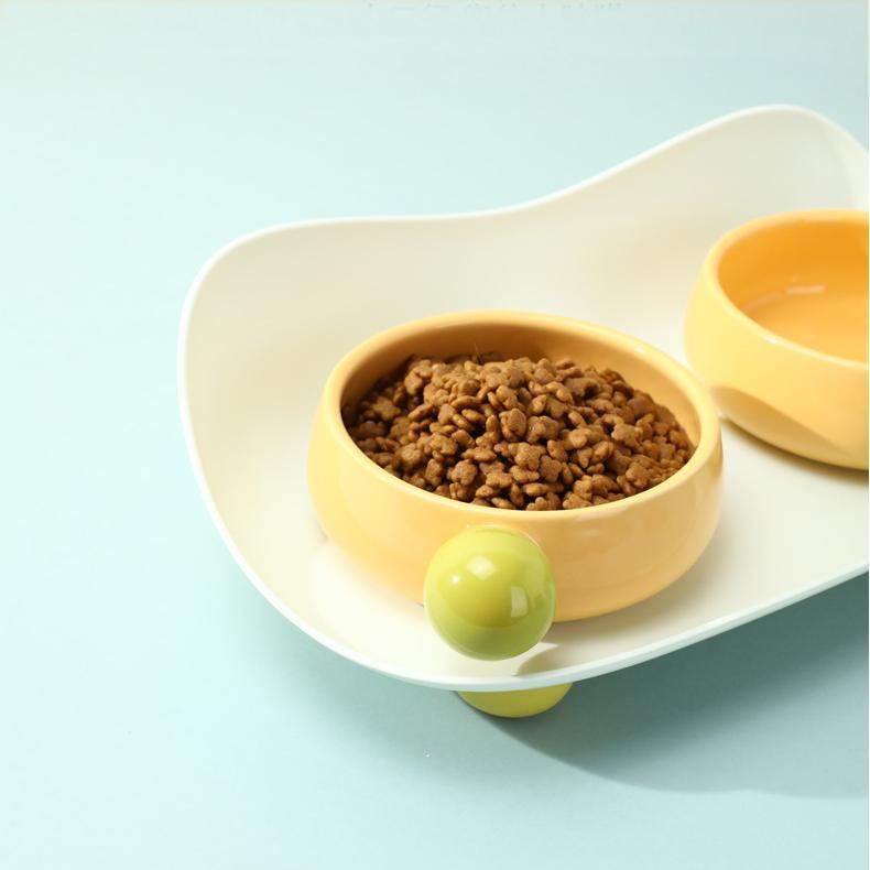 Close-up of single yellow Sugar Bean Ceramic Cat Bowl with kibble