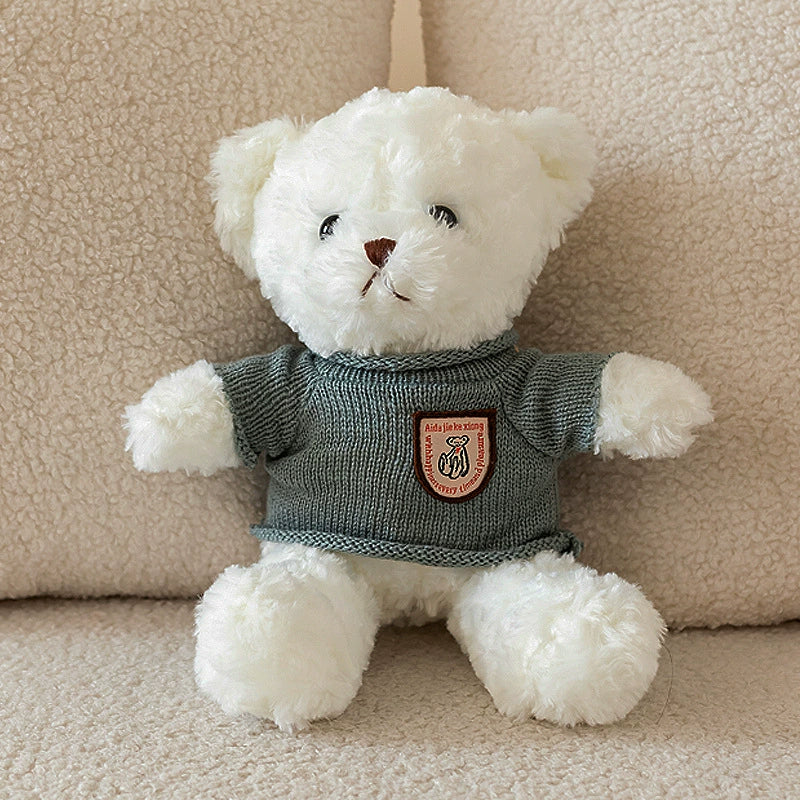 White Teddy Bear Plush in grey sweater with chest badge, inspiring strength, SundayHue Plush Toys