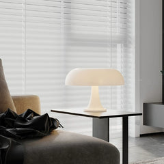 The versatile Mushroom Desk Lamp serves as a beautiful accent light on a side table in a contemporary living room, providing a gentle and calming ambient glow.
