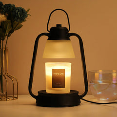 Vintage black candle warmer lamp glowing warmly, enhancing the fragrance of a scented candle