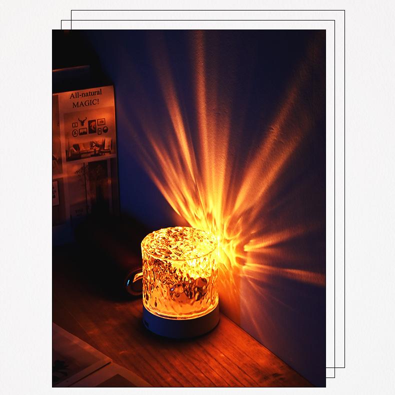 Water ripple aurora decorative light casting warm golden rays onto a wall, creating a soothing and atmospheric ambiance.