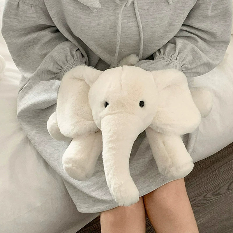 White elephant plush toy gently held on a person's lap, ideal for stress relief and moments of closeness.